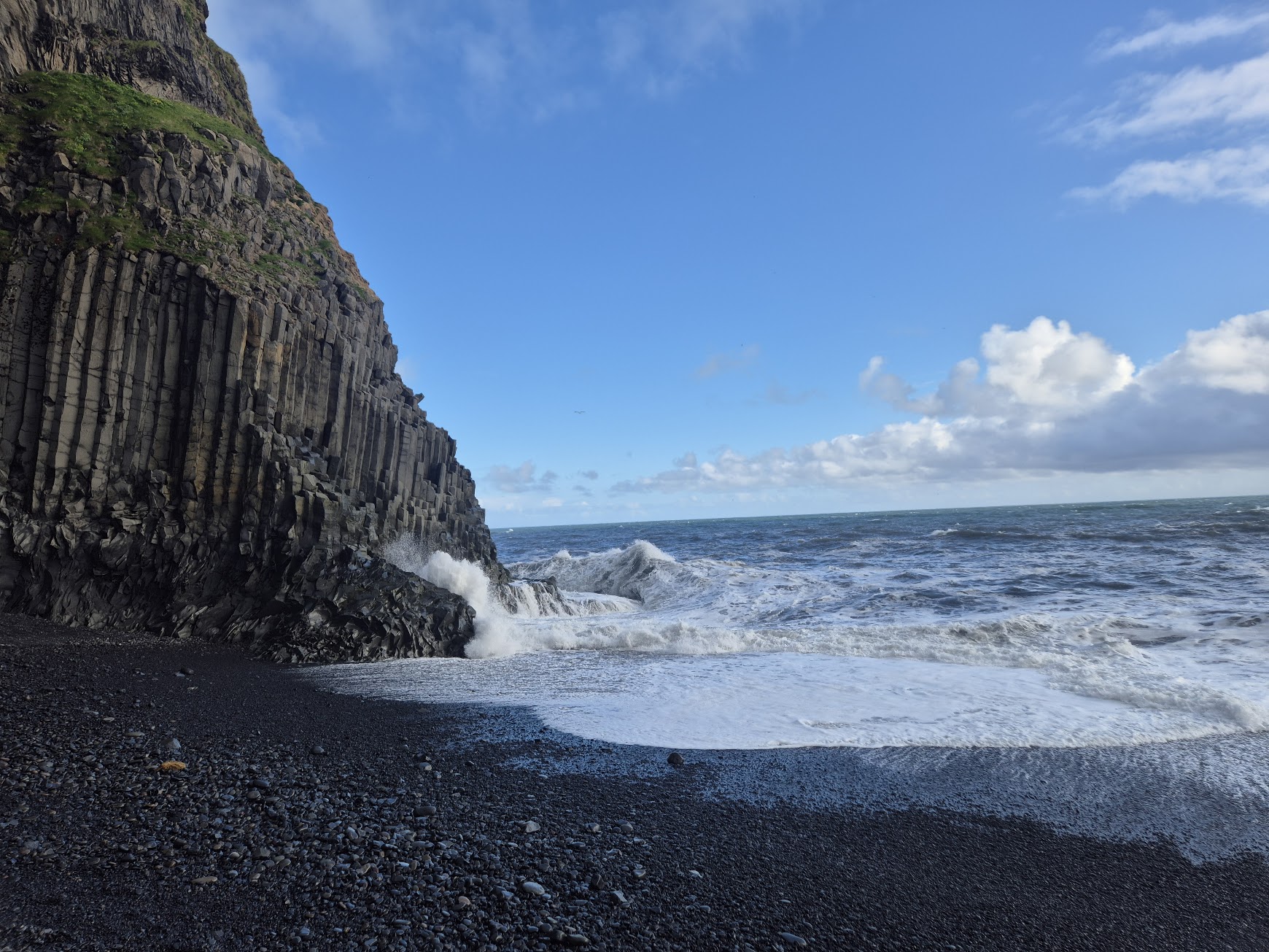 Basalt columns and crashing waves at Reynisfjara black sand beach