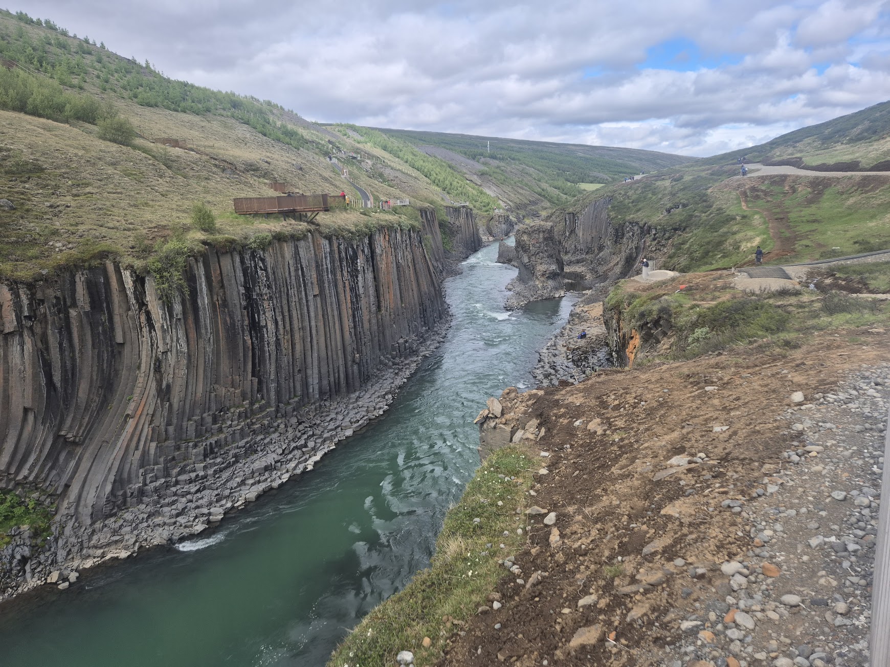 Stuðlagil canyon with the turquoise Jökla river winding between sheer basalt cliffs