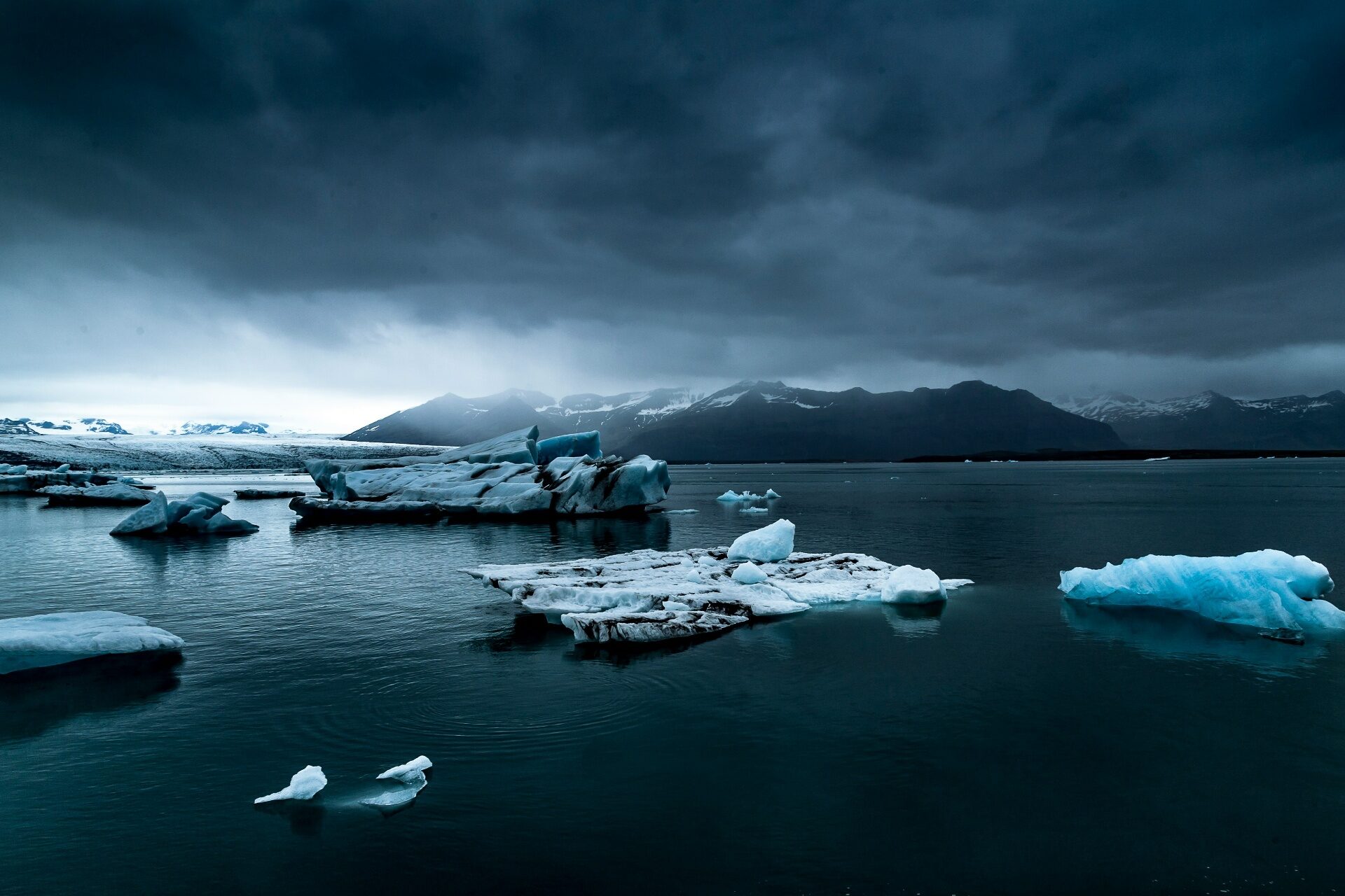 Dramatic Iceland landscape — icebergs in Jökulsárlón glacier lagoon under dark skies